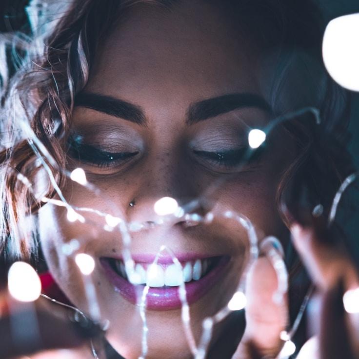 Aisha Kapoor, Lead Design Curator at Radiant Bridge Center, reviewing corporate floral arrangements